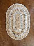 Tan oval rug